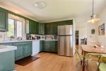 Full kitchen and stainless steel fridge